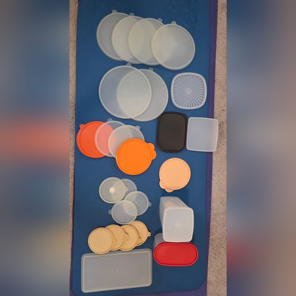 Assorted Tupperware  lids and containers in various sizes and colors.